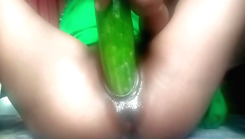 Indian girl masturbates with a dildo and a cucumber