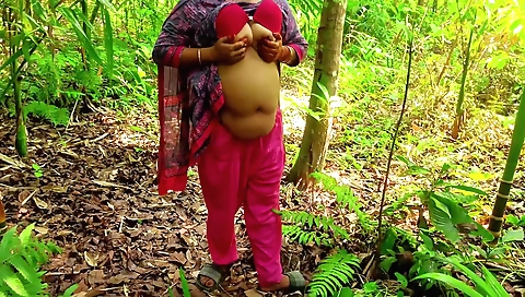 Brunette with big natural boobs and a nice ass in the jungle