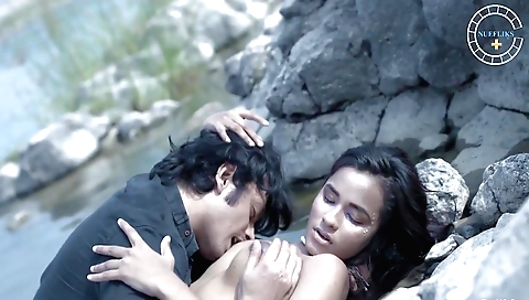 Beautiful brunette beauty with a cute figure in outdoor scene