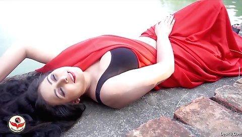 Big boobed brunette indian girl taking a nap outdoors