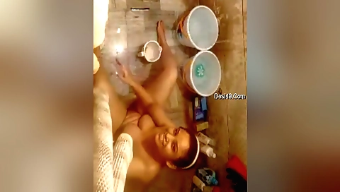 Chubby brunette with big tits is fingering her pussy