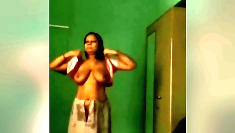 Sexy brunette wearing a bikini and showing her tits