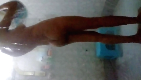 Sexy brunette showing her body naked in the shower