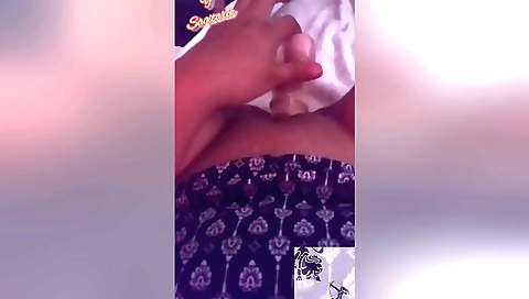 Indian girl with plastic dildo fucks herself on the couch