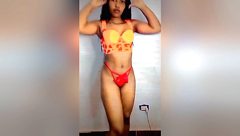 Sexy brunette in a sexy dress and blouse in a red dress