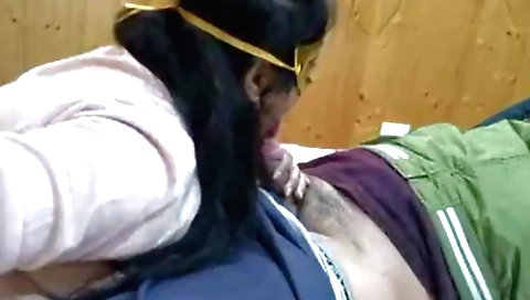 Brunette babe with a nice face in the video is smoking a facial