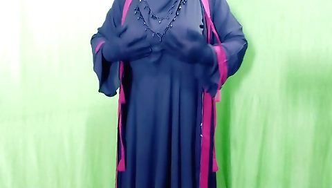 Indian girl in a sexy dress gets on her knees for a solo video