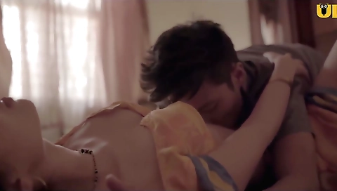 Sexy brunette girl with big boobs is making out with a guy