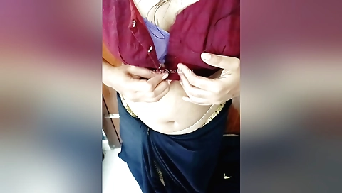 Indian girl in black skirt and white blouse making solo video