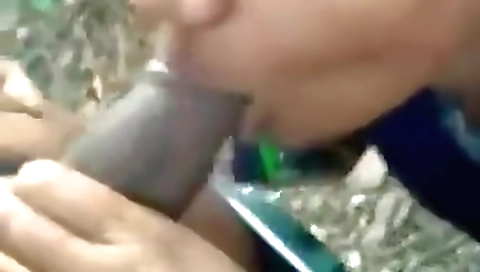 Brunette indian chick sucking a big deepthroat cock