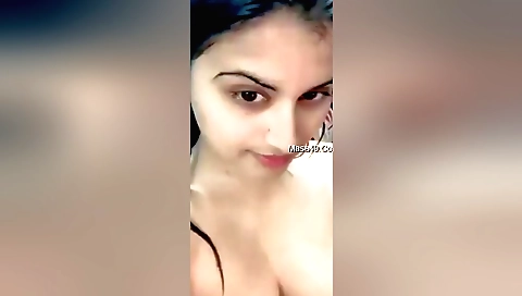 Indian brunette girl shows off her small boobs with her naked body