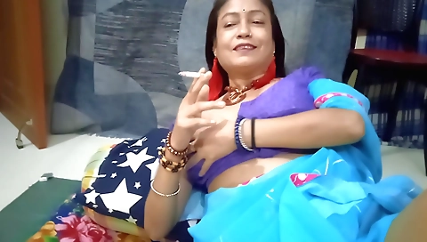 Chubby indian brunette enjoys smoking in solo video