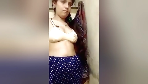 Brunette amateur chick shows her beautiful face and tits