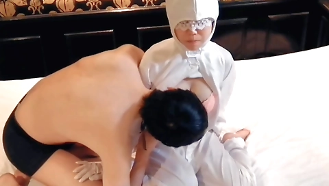 Amateur brunette with large tits rubs breasts of an inspector