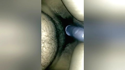 Hairy Indian girl in a bikini enjoys licking her pussy