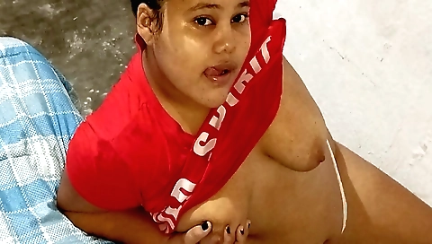 Beautiful brunette with big boobs is cleaning the room