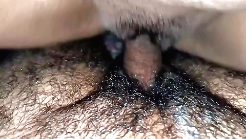 Indian woman with a hairy pussy is enjoying her cock