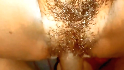 Indian brunette with a hairy cunt fucks on the camera