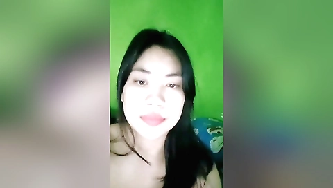 Indian brunette in a black dress and a black t-shirt