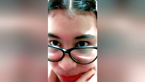 A sexy brunette takes off her clothes and does masturbation